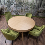 Zielone krzesełko z oparciem przy okrągłym stole